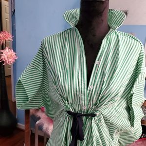 Green and white blouse with black belt